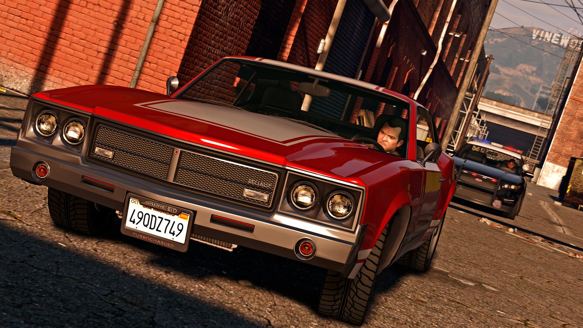 A red muscle car parked in a Los Santos garage
