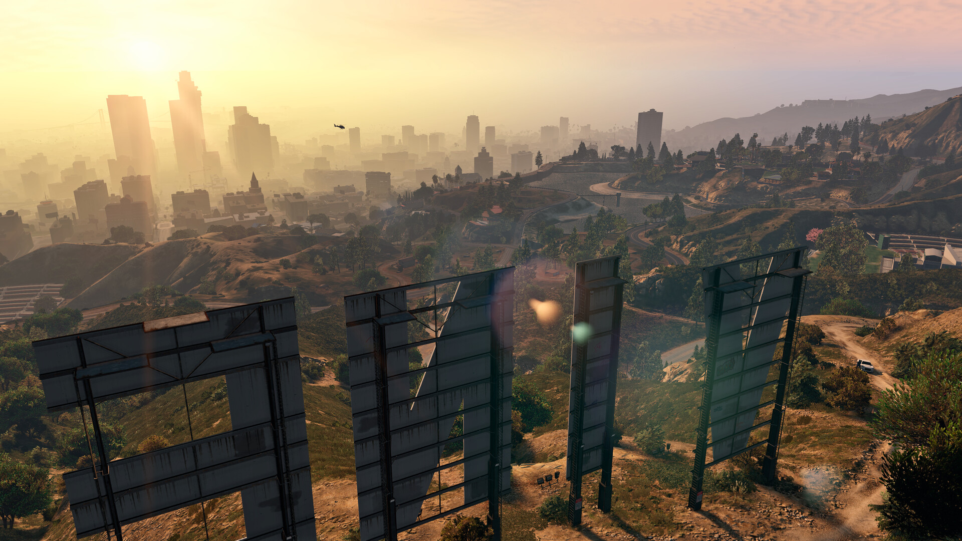 The Vinewood sign on the hills above Los Santos at golden hour