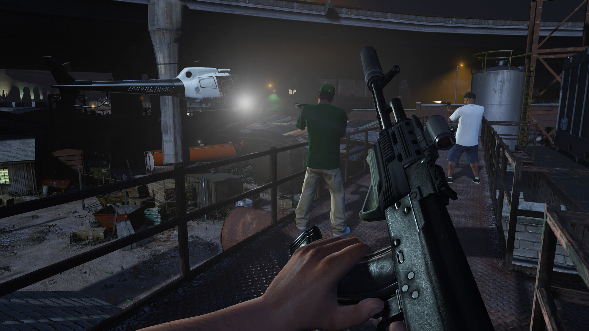First-person view down the sights of a carbine at an industrial site
