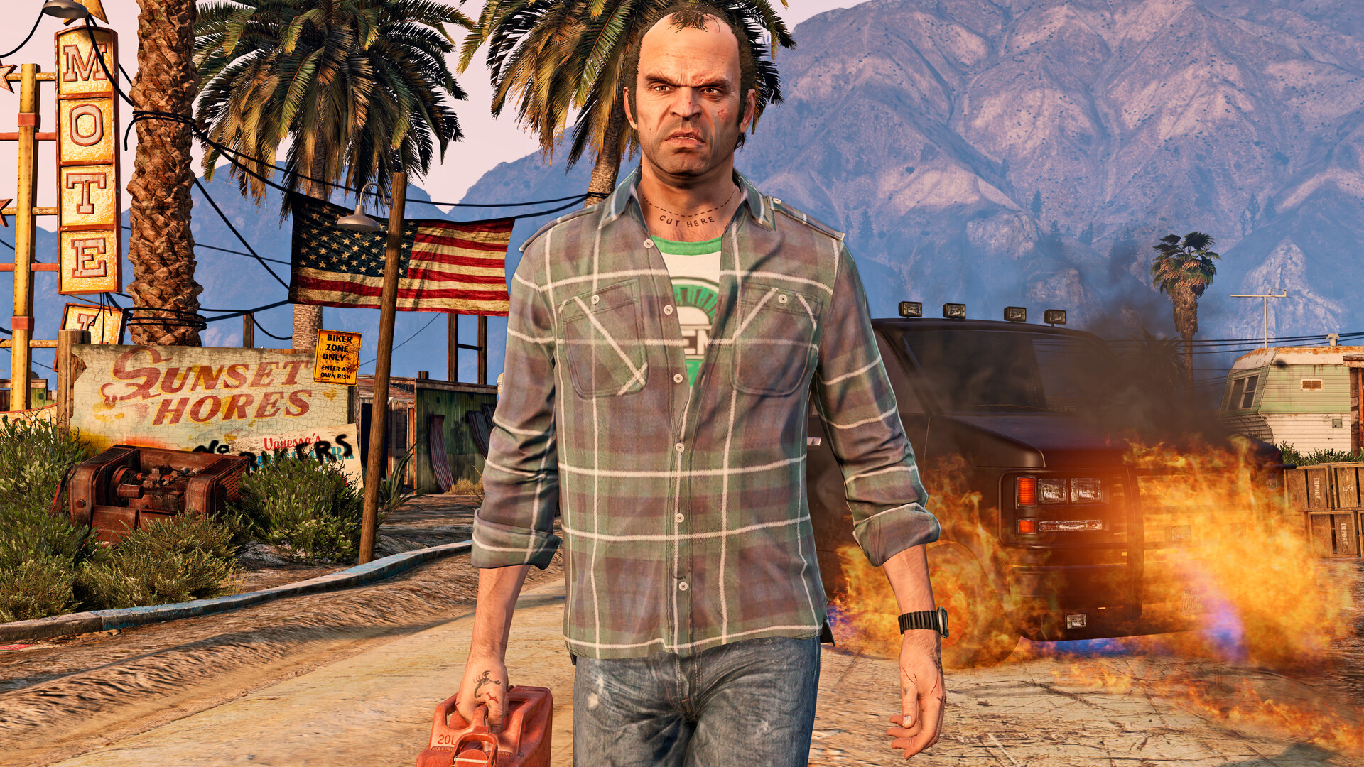 Trevor walking away from a burning motel with a jerry can in his hand