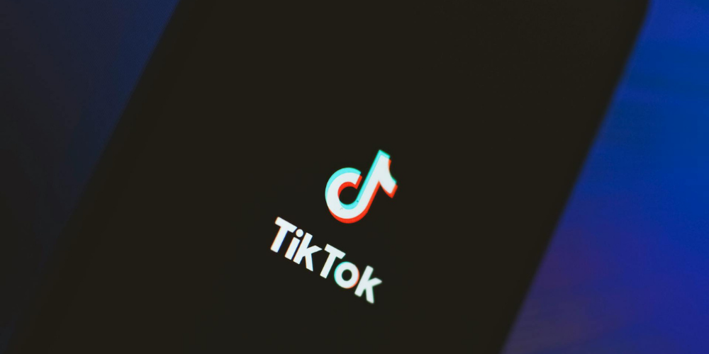 Adobe Express Integrates TikTok's Creative Assistant for Streamlined Content Creation Logo